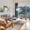 a living room with a couch, a chair and a tv
