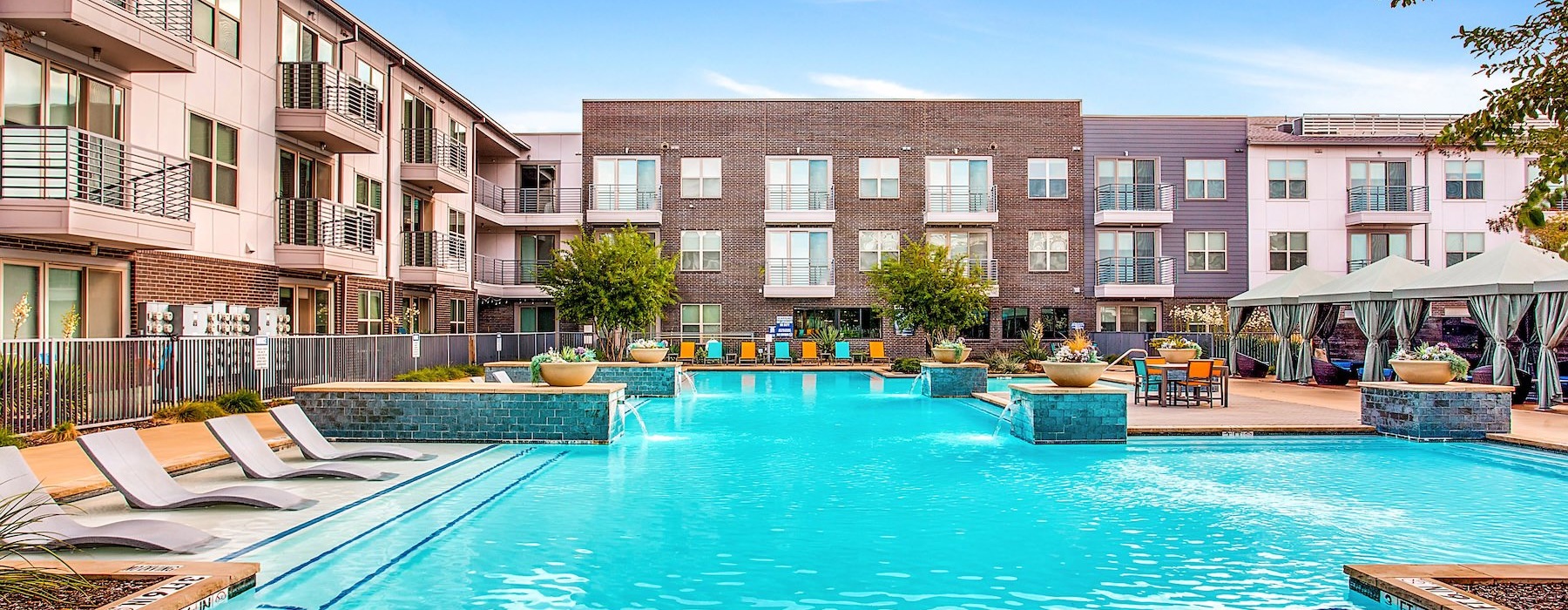a swimming pool in front of a building