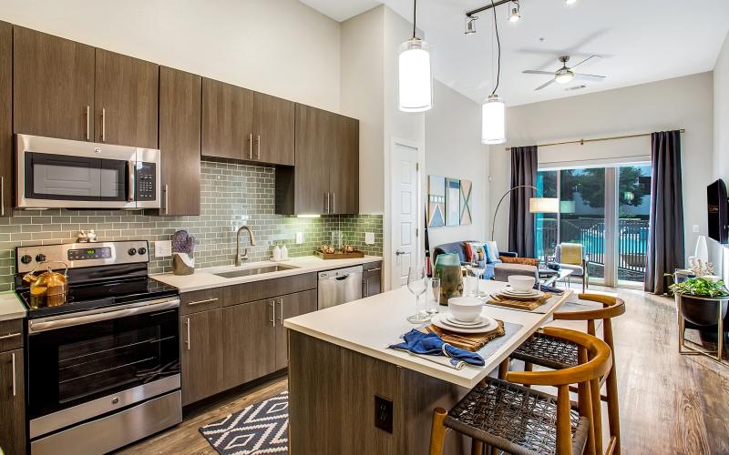 a kitchen with wooden cabinets